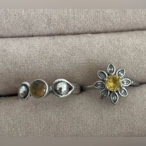 (2) rings sterling Silver and tigers eye and yellow colored stone